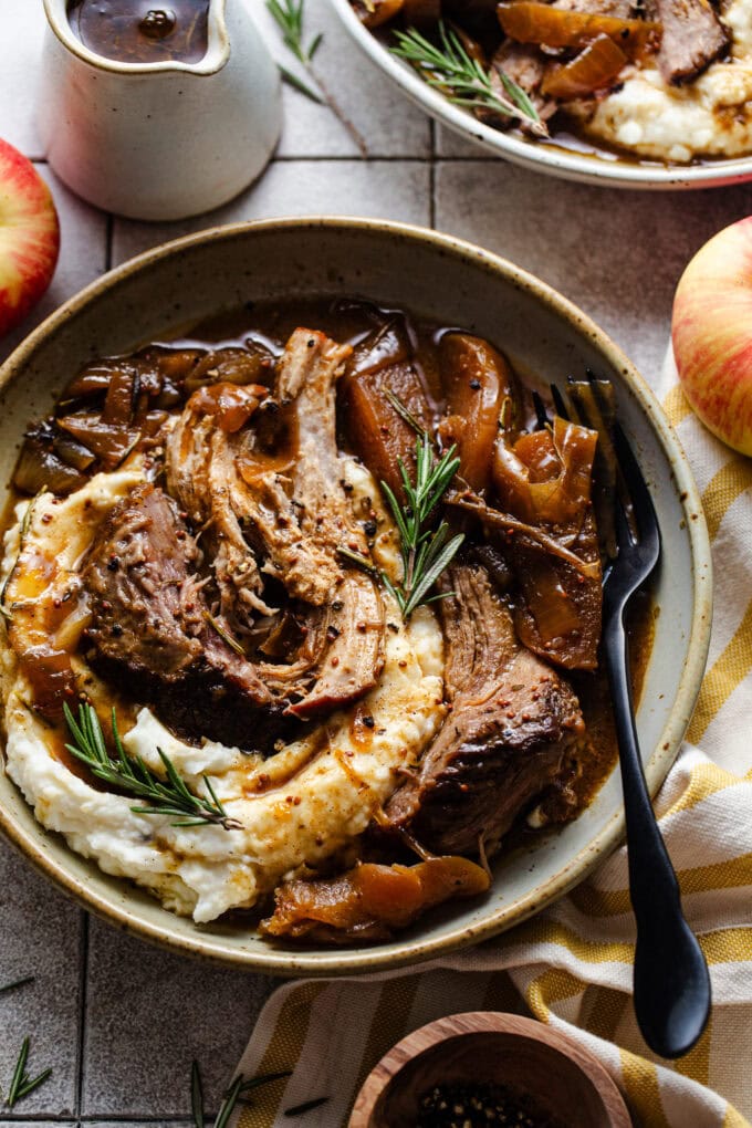 braised pork shoulder with mashed potatoes in bowl