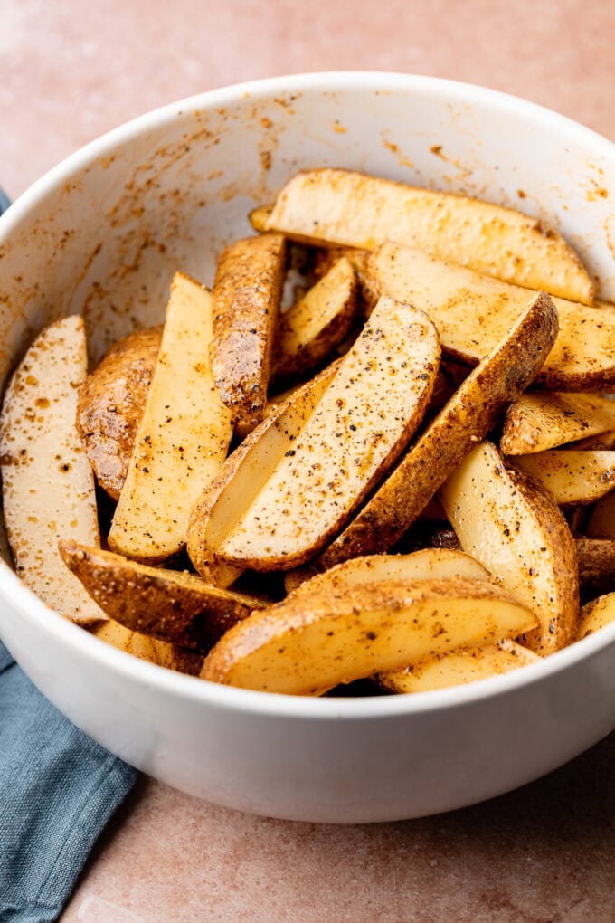 seasoned potato wedges in bowl