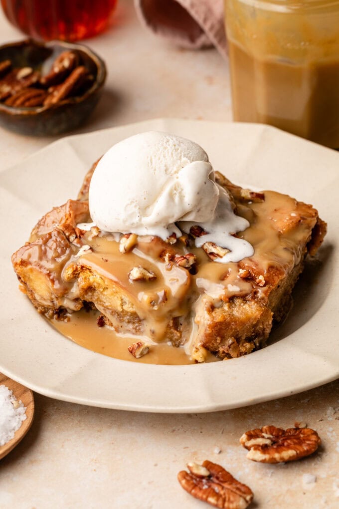 sliced sweet potato bread pudding with ice cream on plate