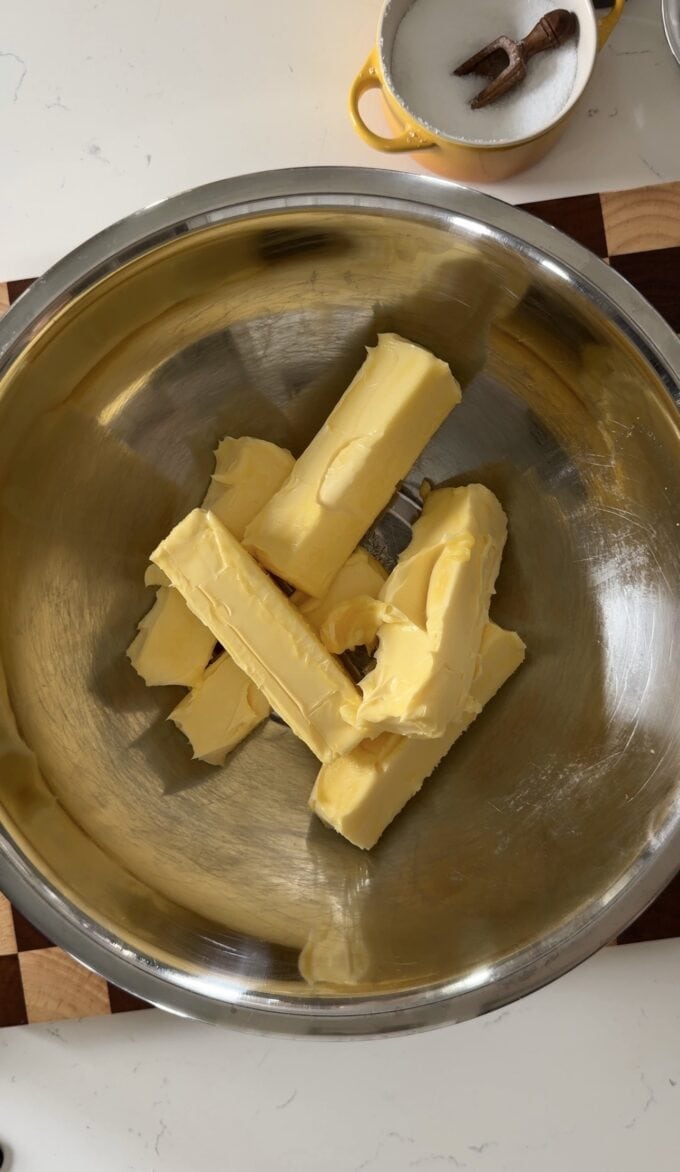 sticks of butter in stainless steel bowl