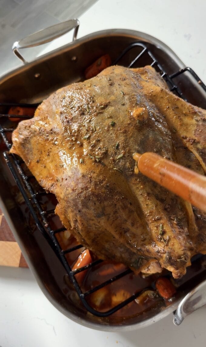 turkey baster basting turkey with Cajun compound butter