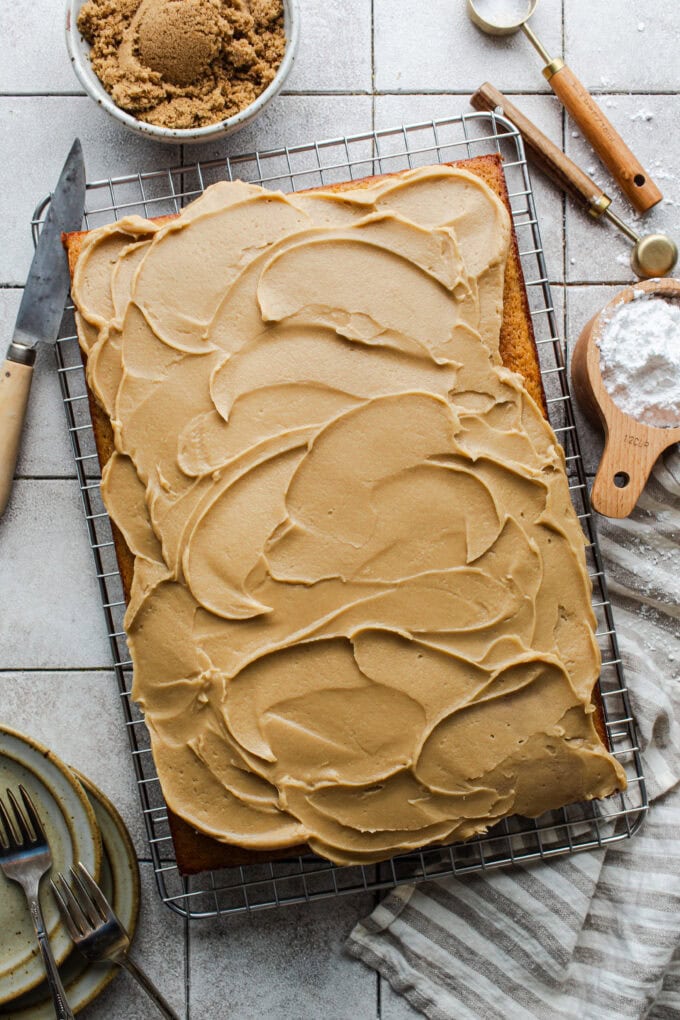 caramel icing on cake on wire rack