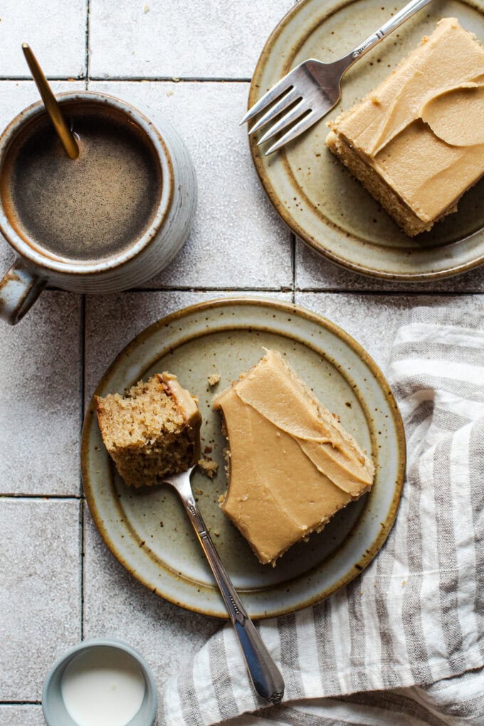 caramel cake slice on small plate with fork