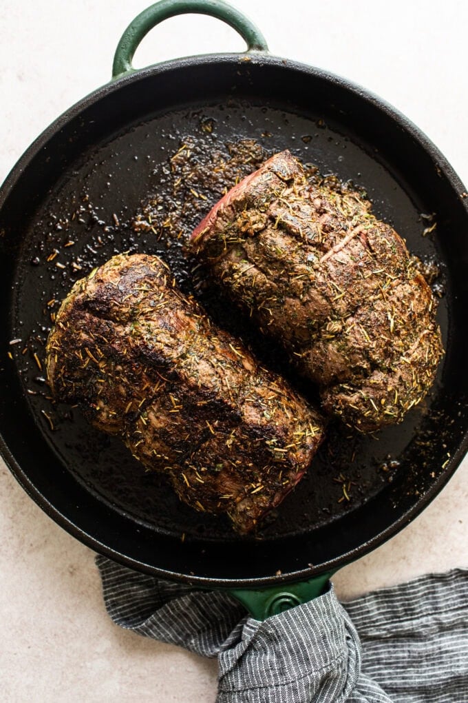 beef tenderloin searing in cast iron skillet