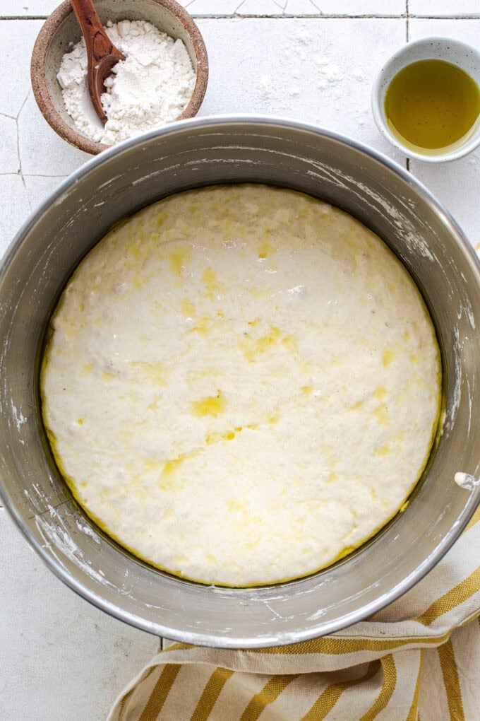raw focaccia dough in steel bowl