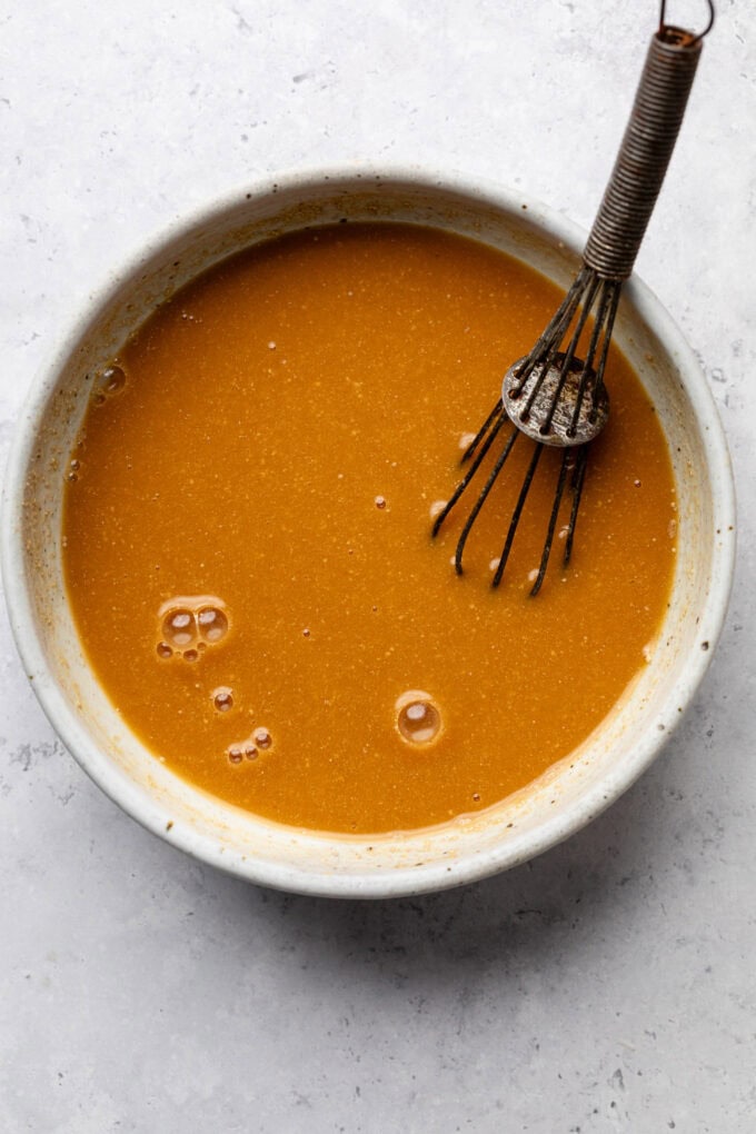 miso sauce in bowl with whisk