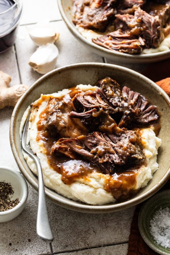 braised short ribs with mashed potatoes in bowl