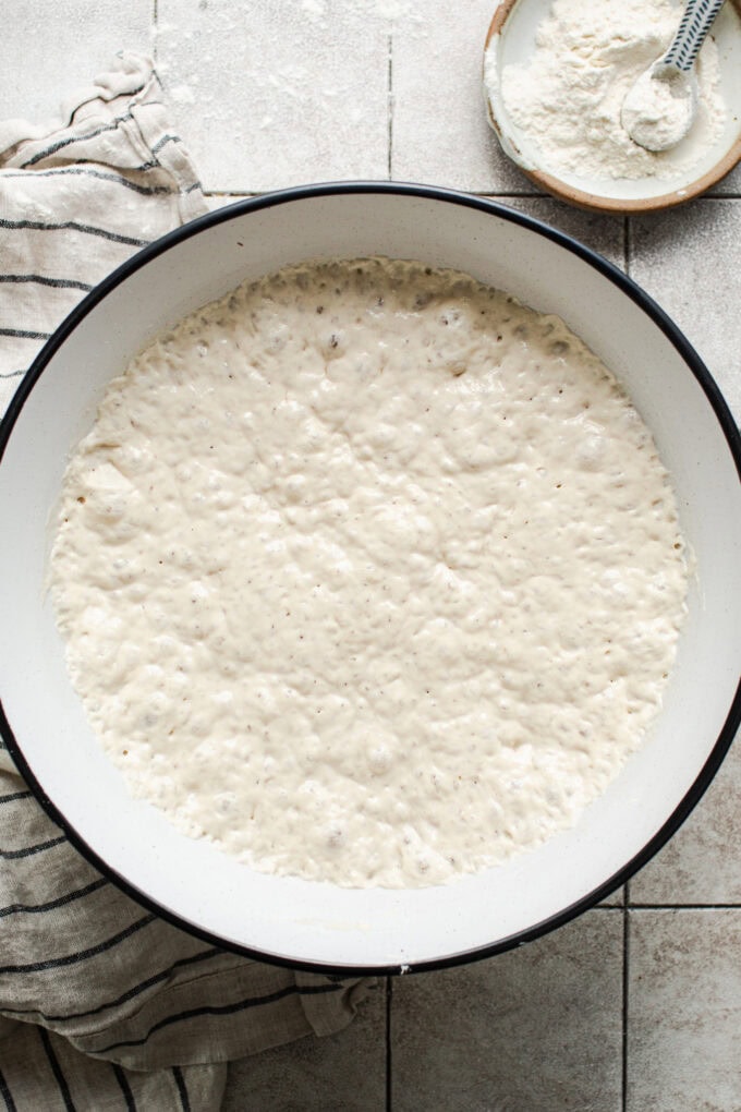 no knead bread dough in bowl proofing