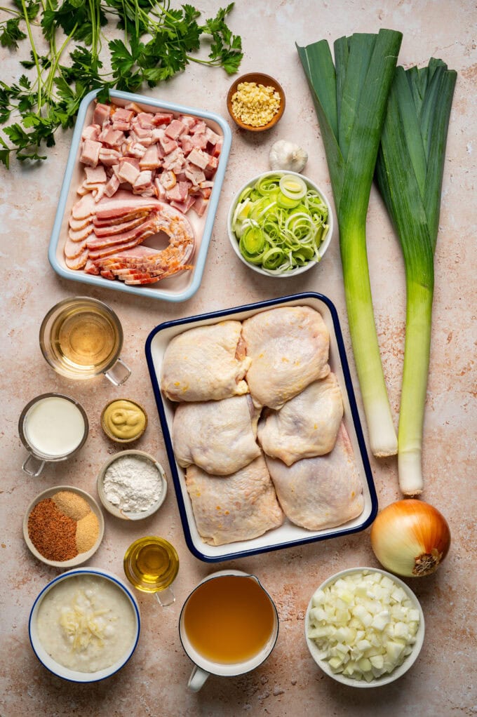 ingredients for creamy chicken with leeks and cheese grits in bowls