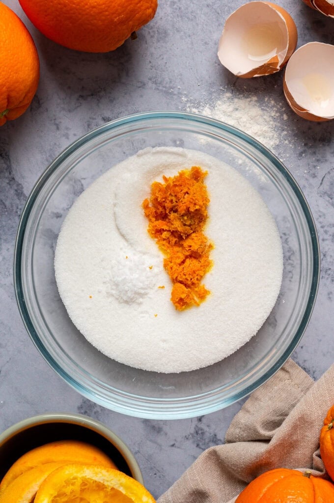 orange zest and granulated sugar in bowl