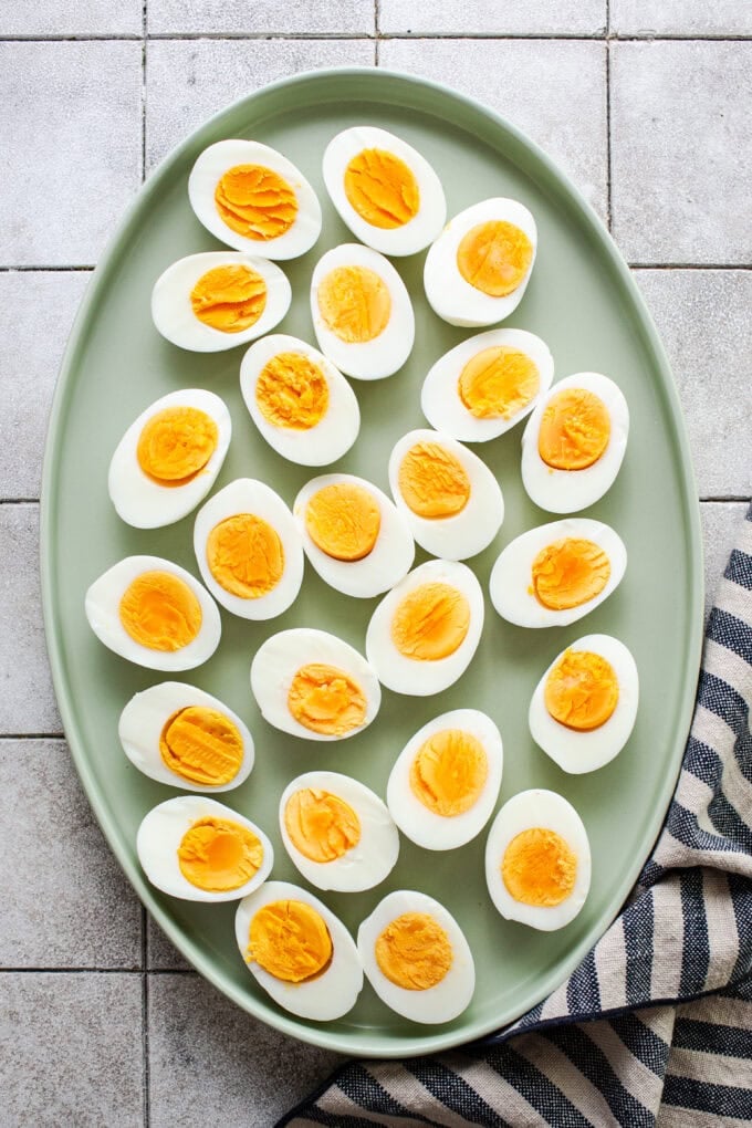 halved hard boiled eggs on platter