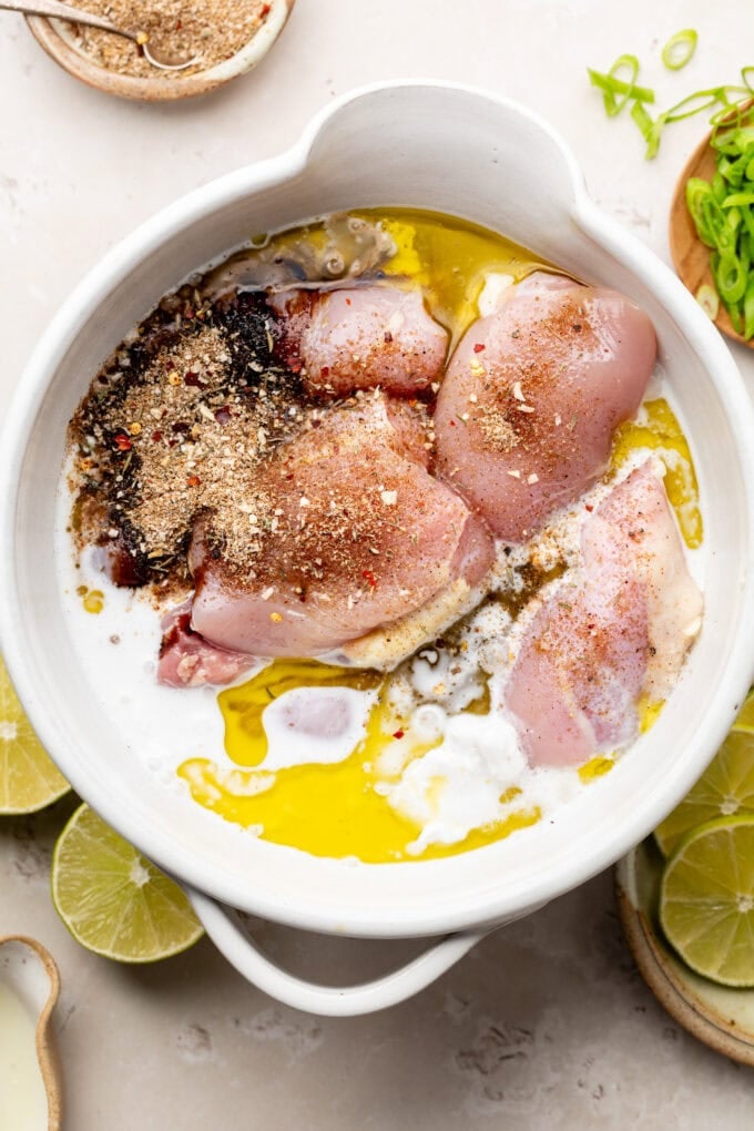 raw chicken with spices in bowl
