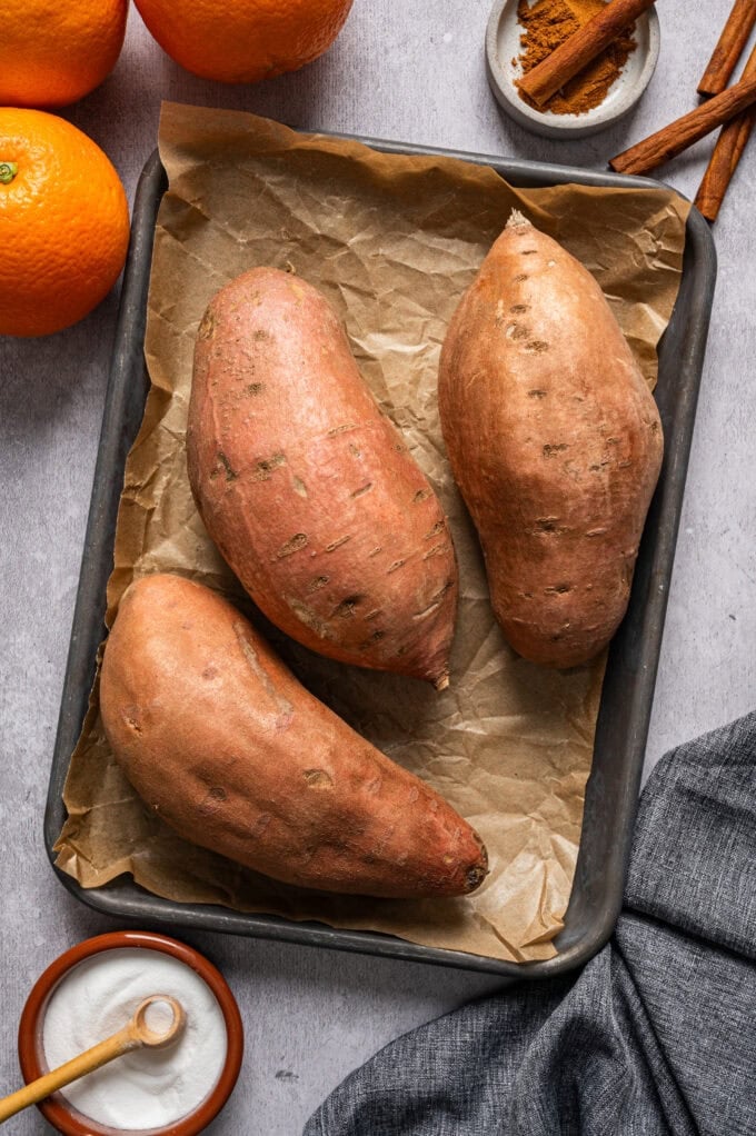baked sweet potatoes on small baking sheet