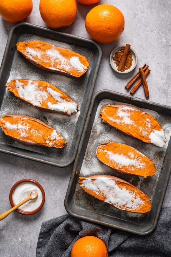 sugar on top of sweet potatoes on baking sheet