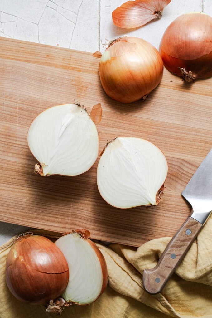 halved onion on cutting board