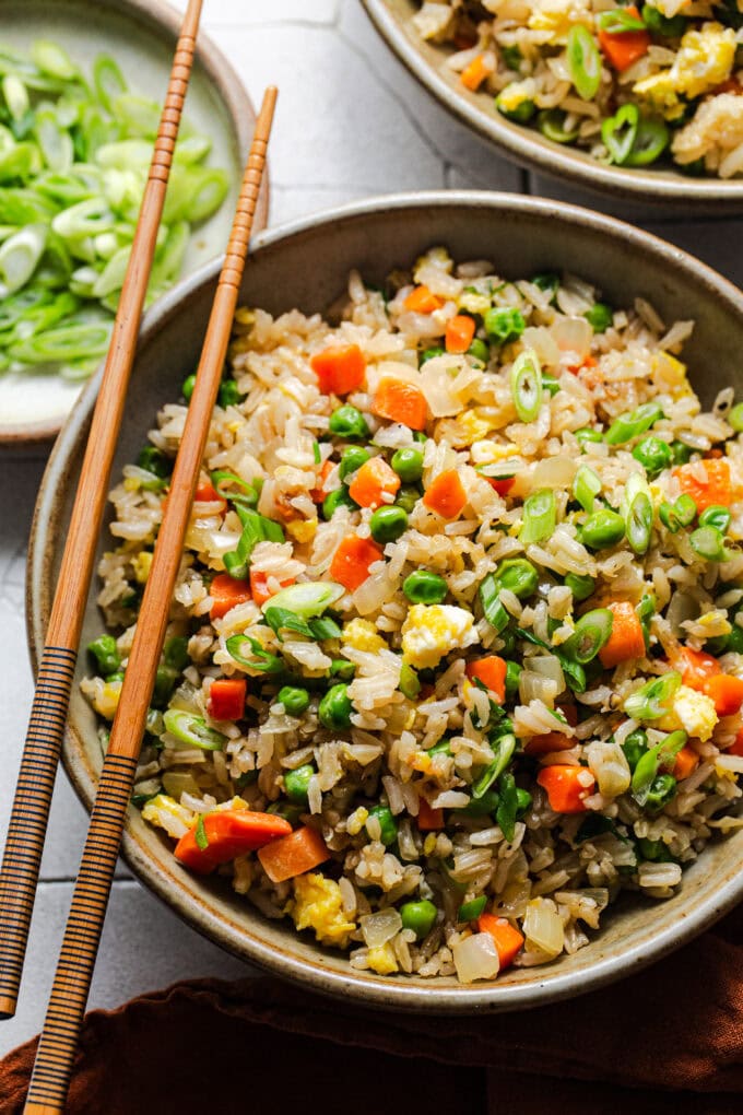 fried rice in bowl with chopsticks
