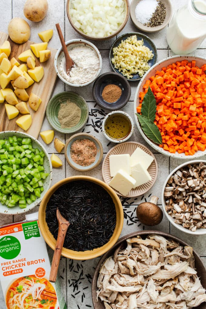ingredients for chicken wild rice soup in bowls