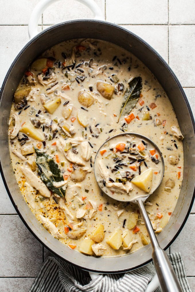 creamy chicken wild rice soup in pot with ladle