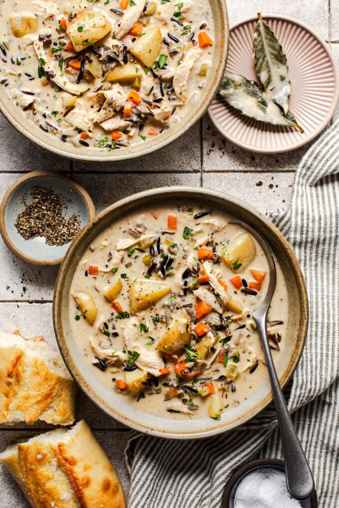 chicken wild rice soup in bowls with spoon
