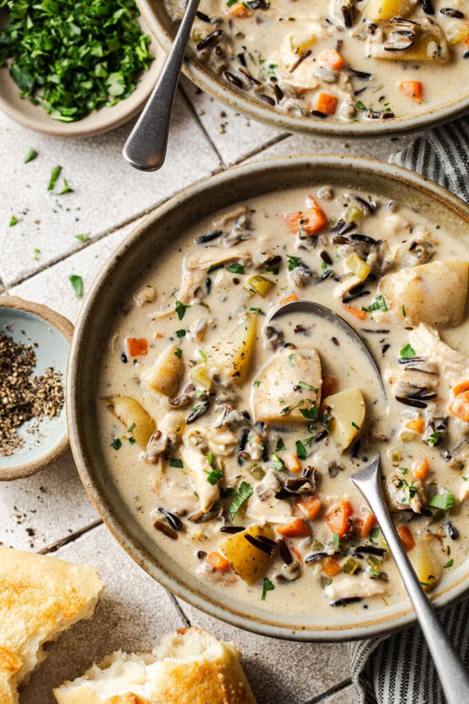 wild rice soup in bowl with spoon
