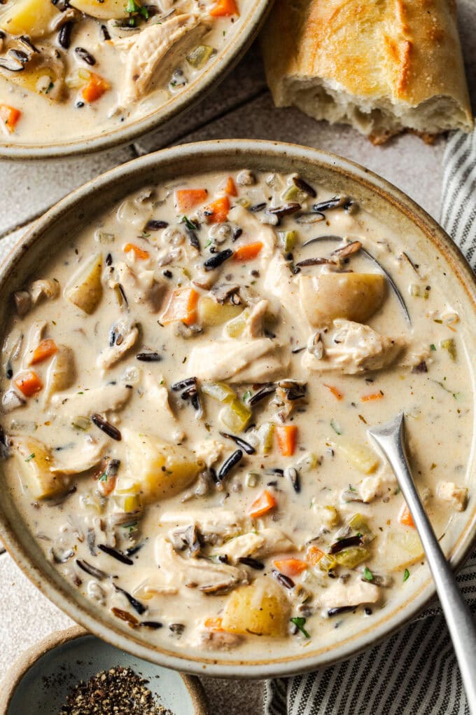 closeup of chicken wild rice soup in bowl with spoon