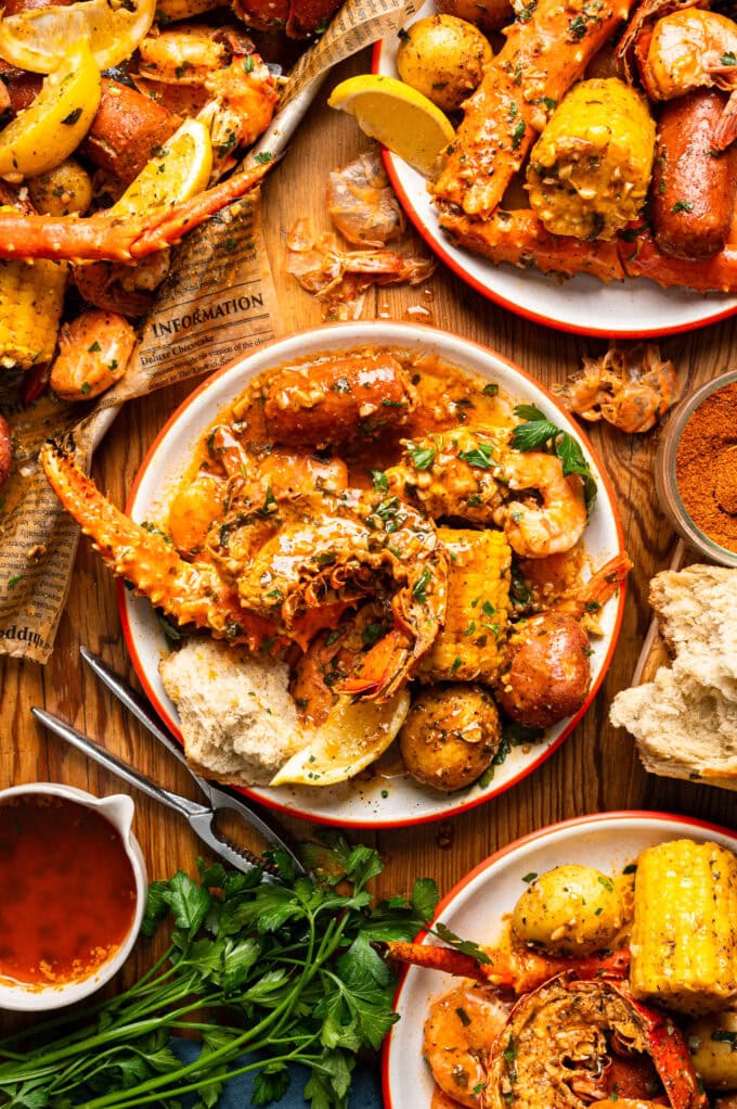 lobster seafood boil on white plates