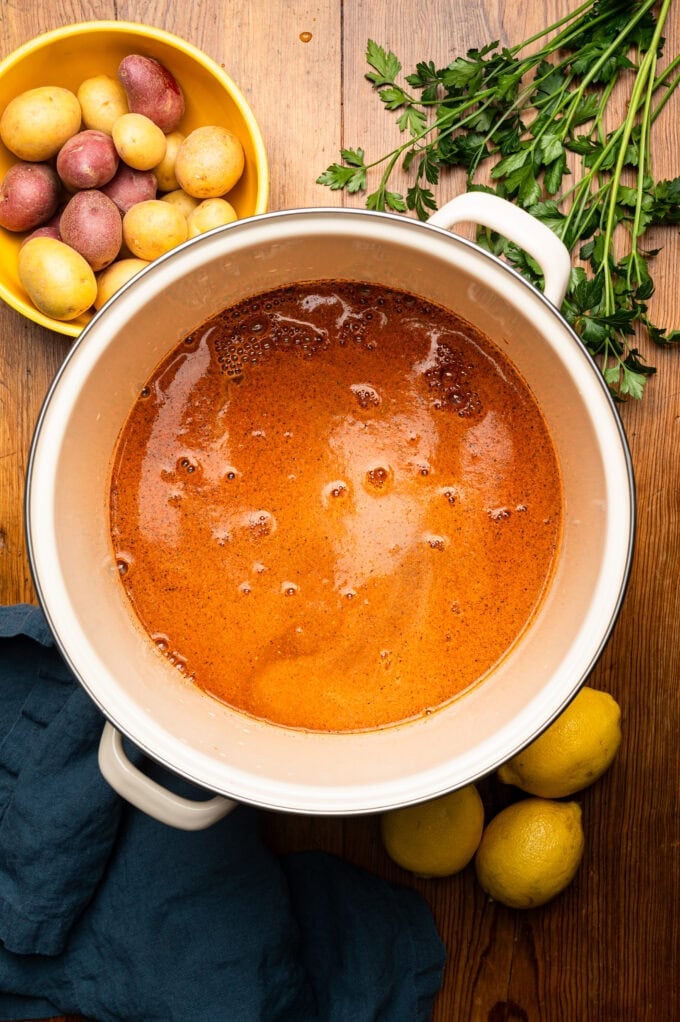 seafood boil pot full of broth and spices