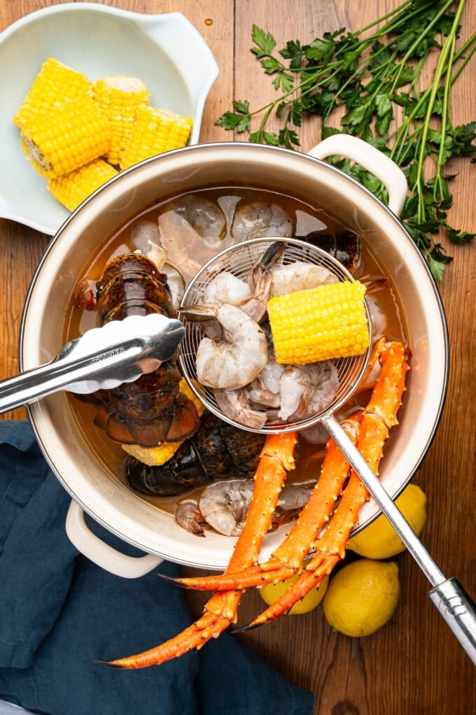 seafood being added into boil