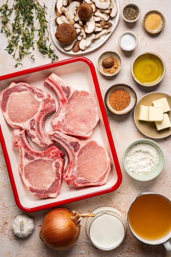 ingredients for smothered pork chops with mushroom gravy in bowls