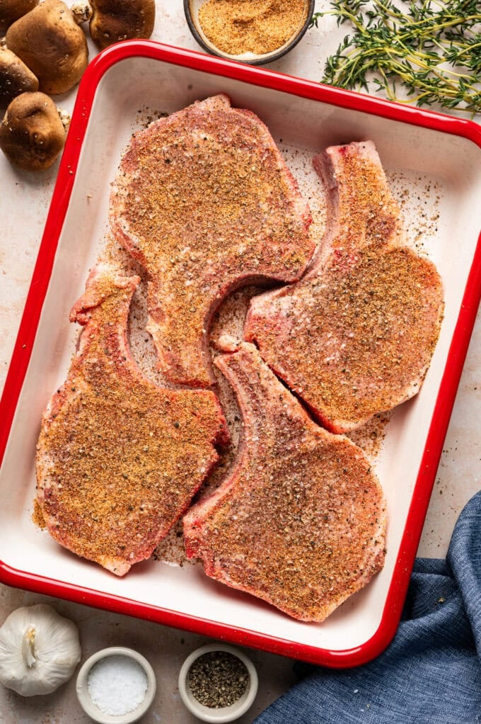 seasoned pork chops in baking dish
