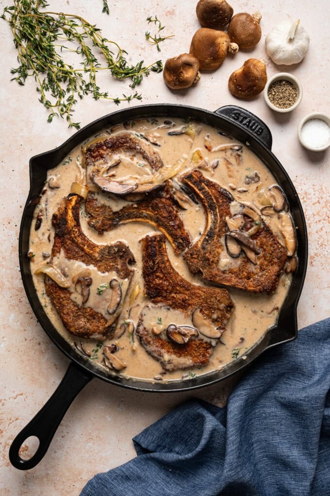 smothered pork chops in skillet