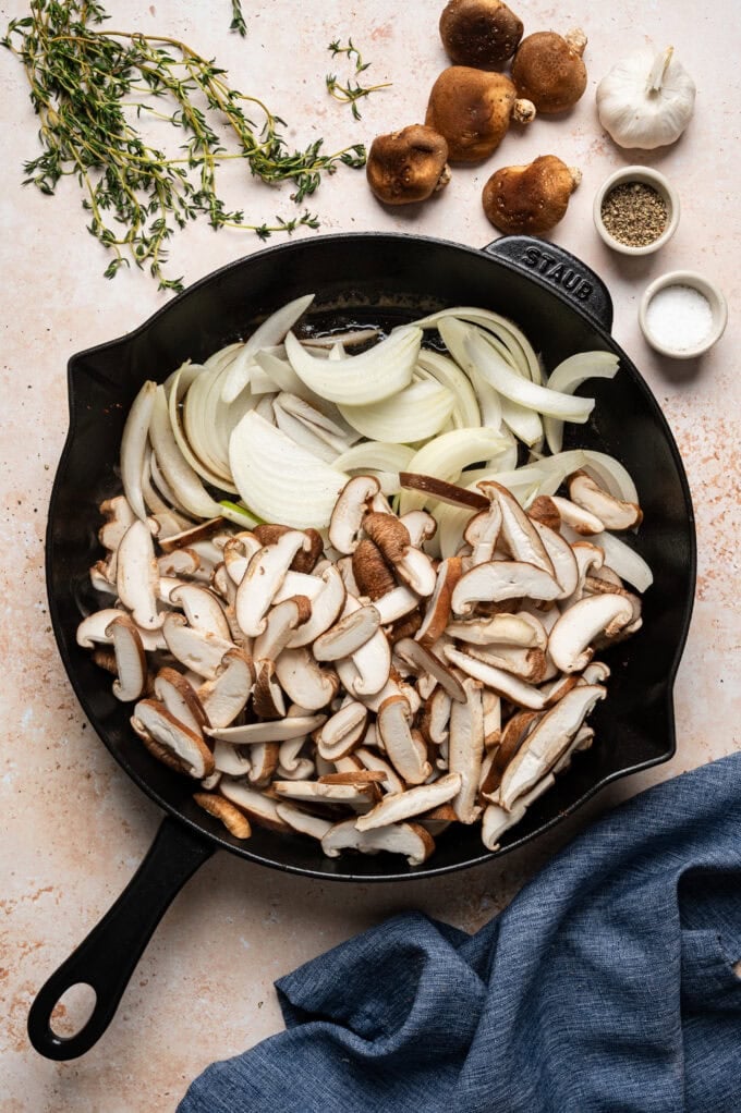 onions and mushrooms in skillet