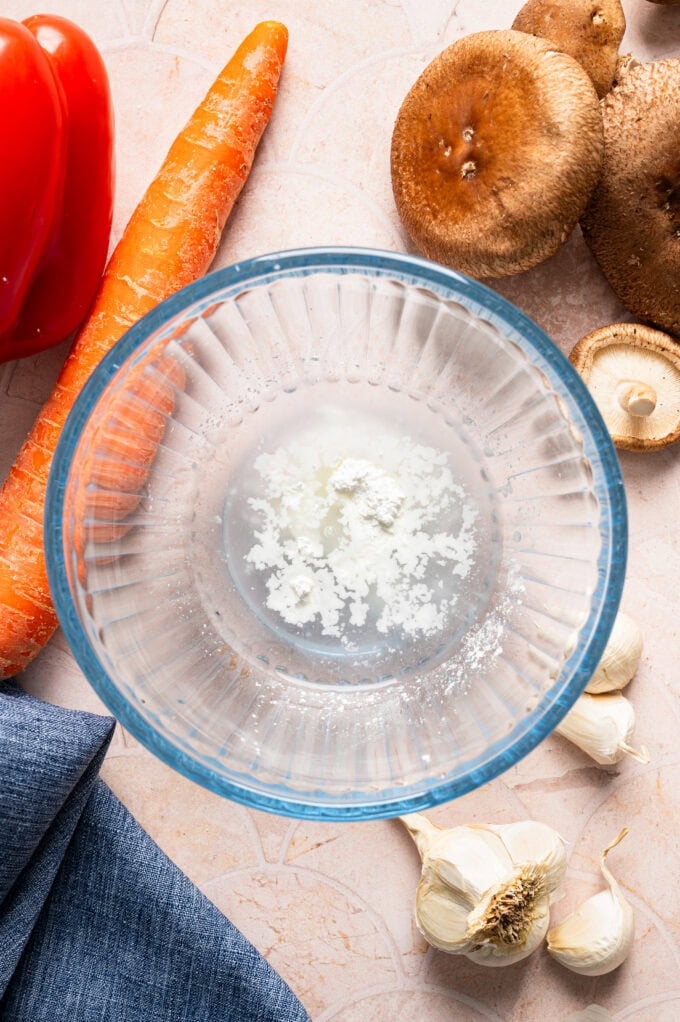 cornstarch and water in glass bowl