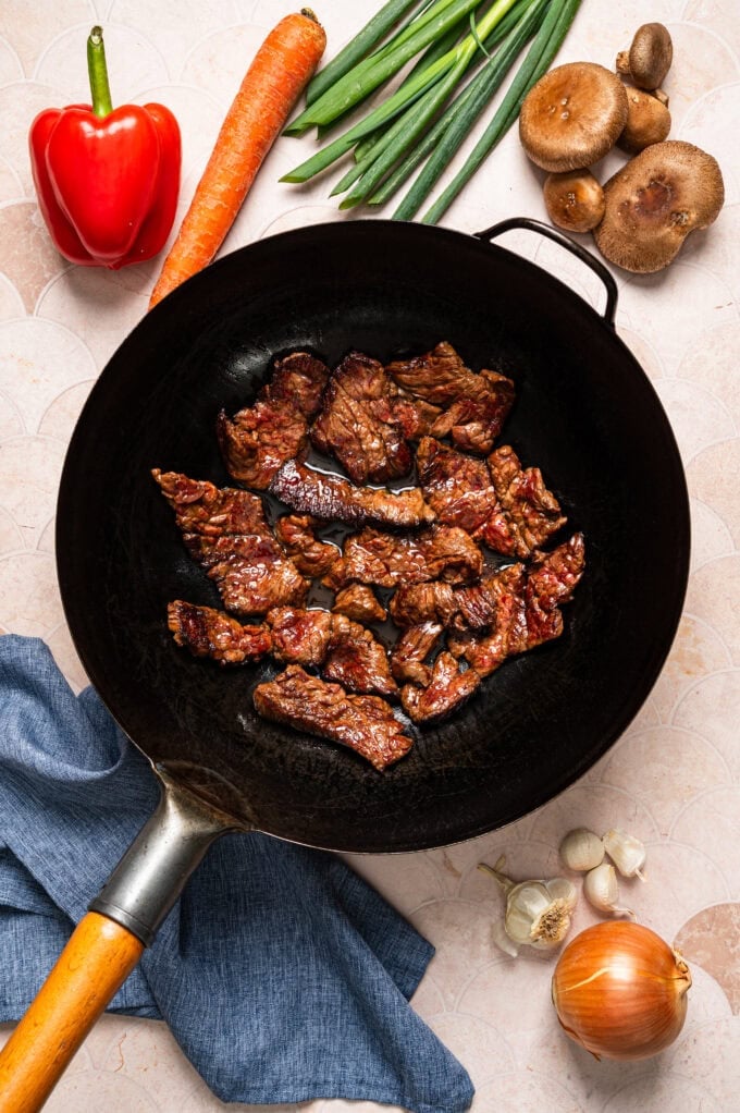 cooked steak in wok