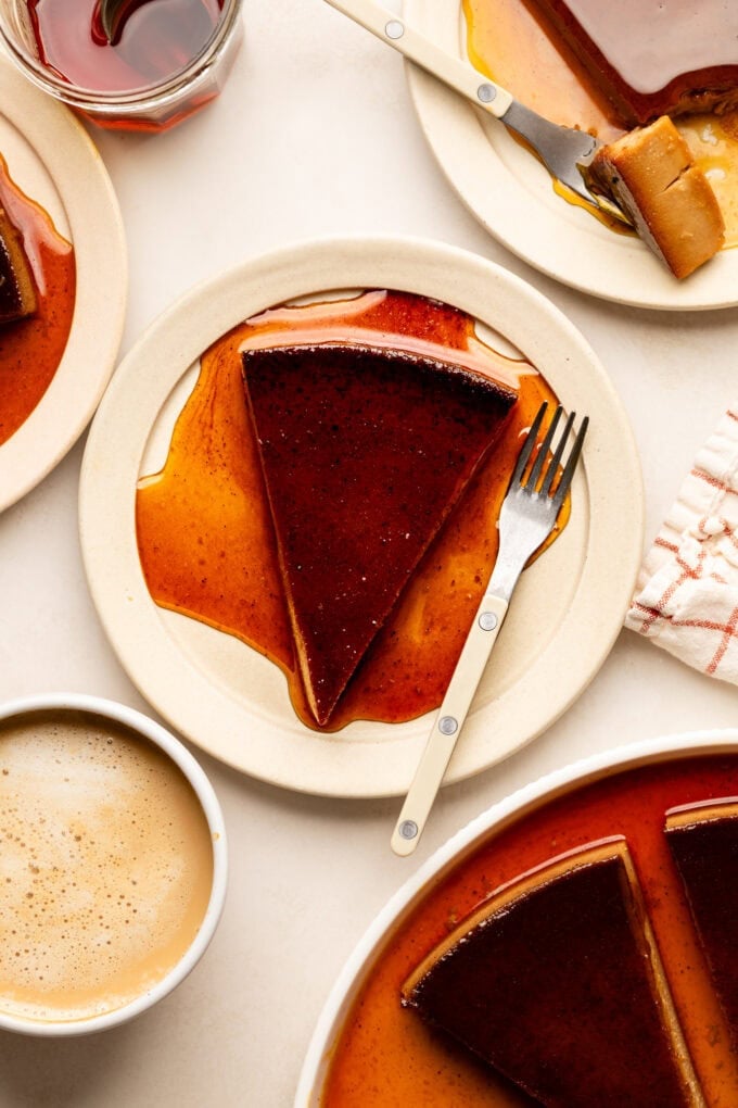 sliced flan on small plate with fork