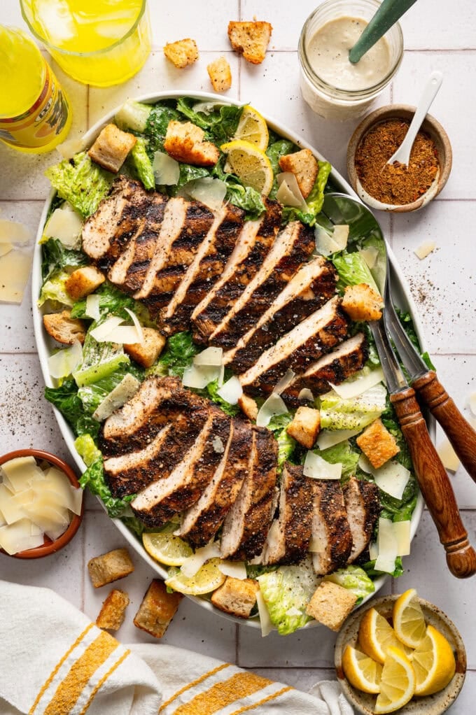 jerk chicken caesar salad in large oval bowl