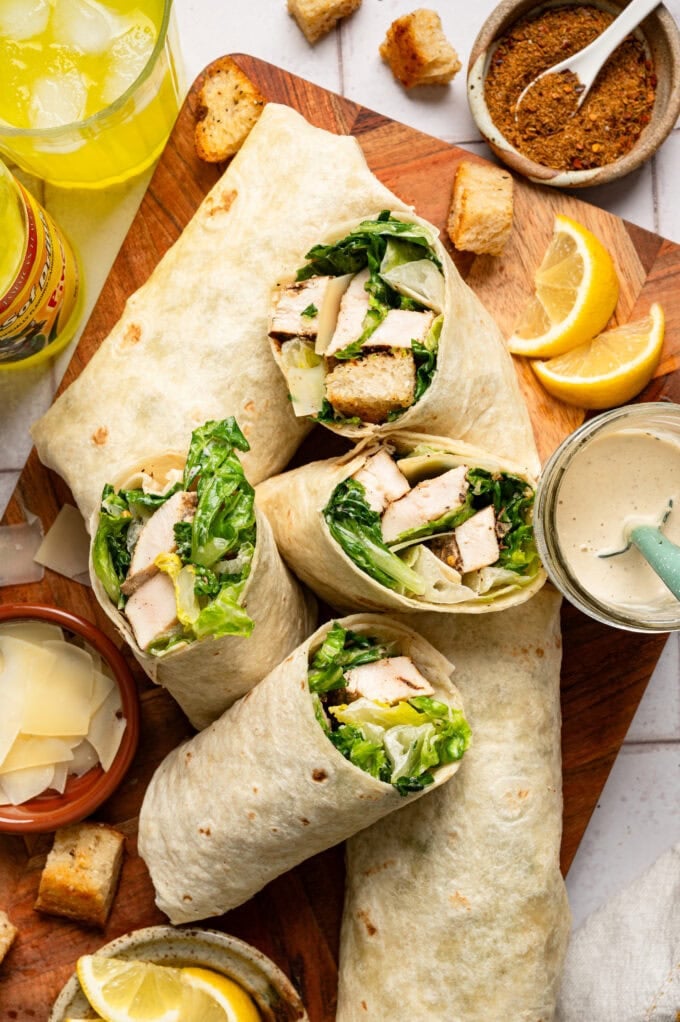 jerk chicken caesar salad wraps on cutting board