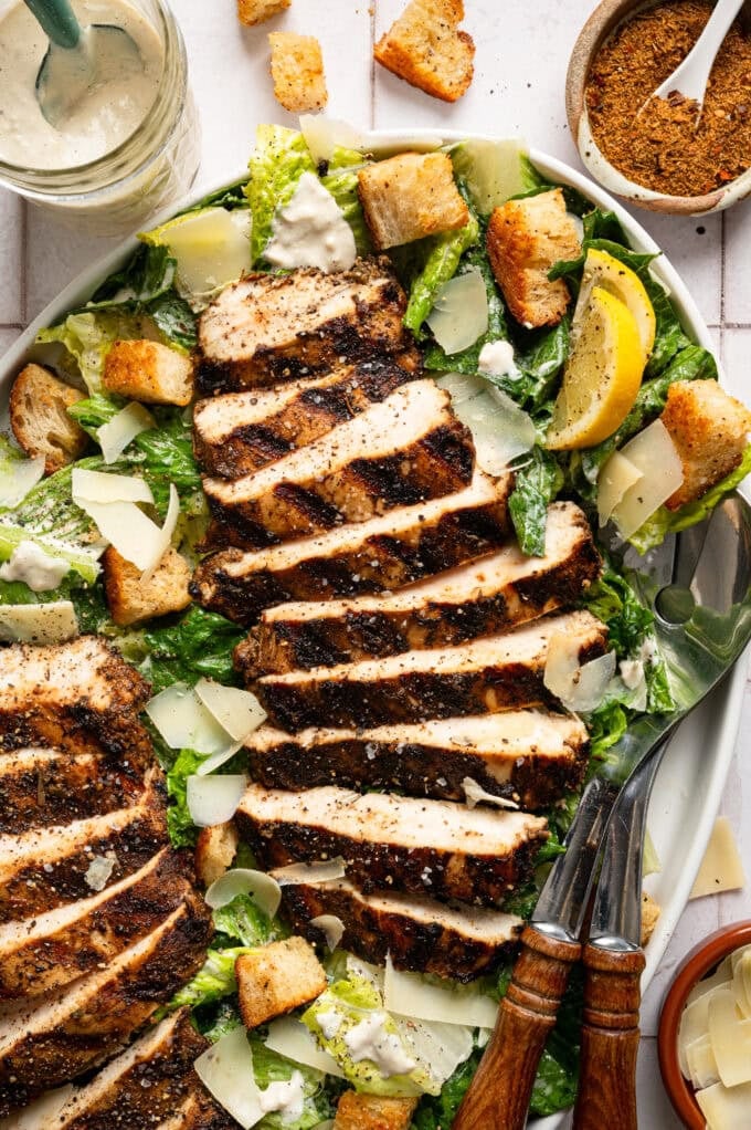 jerk chicken caesar salad on platter