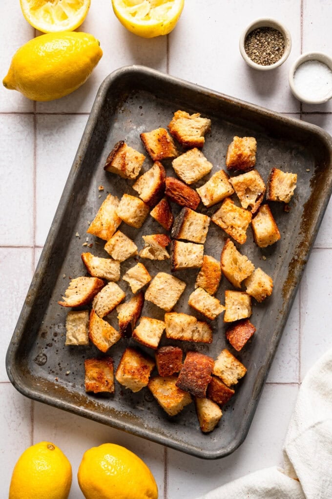 sourdough croutons on baking sheets