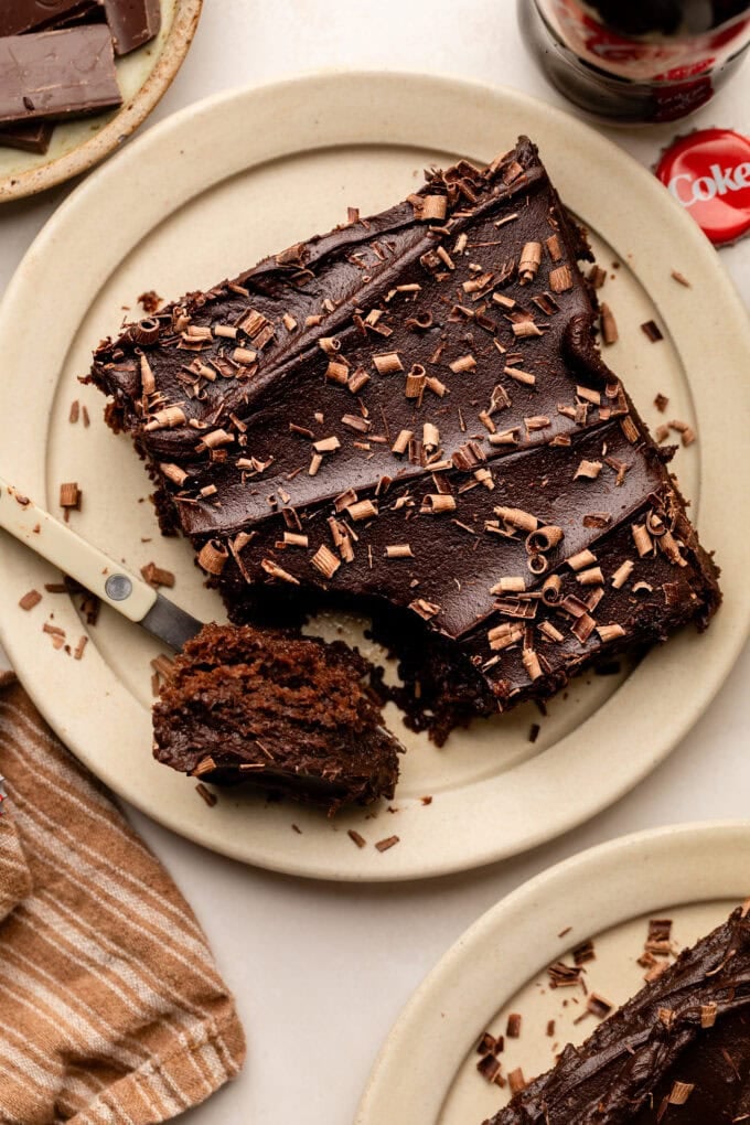 slice of cola cake on small plate with fork