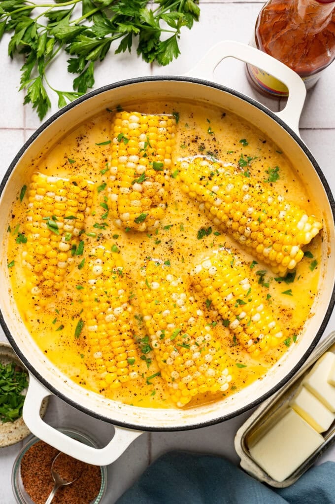 cajun milk-boiled corn on the cob in large white part