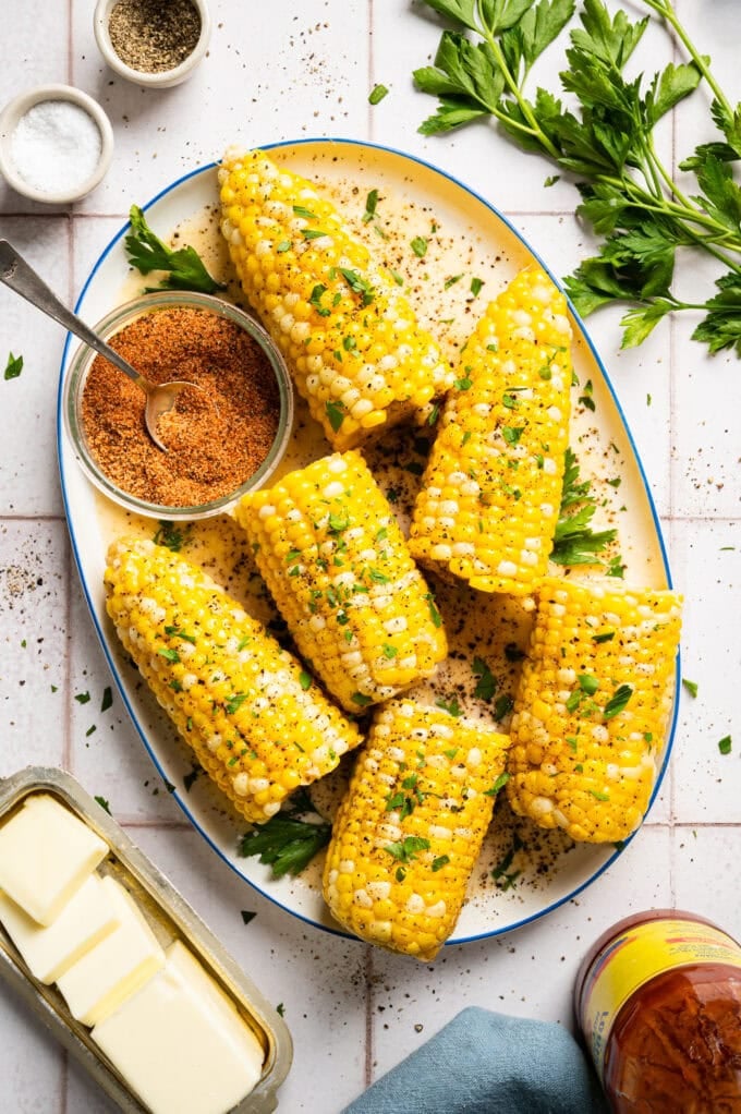 creamy corn on the cob on white platter