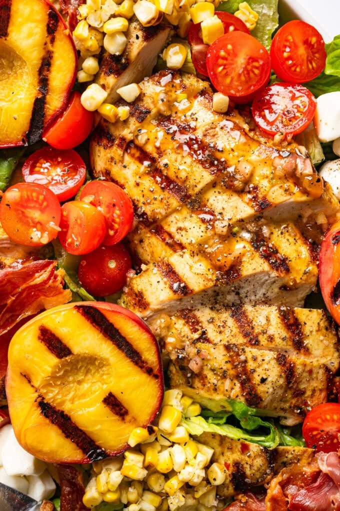 closeup of grilled chicken peach salad