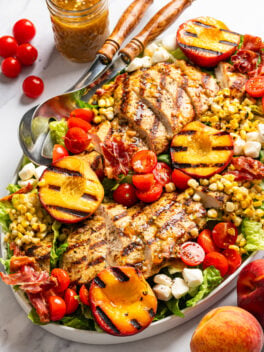 grilled chicken peach salad on platter