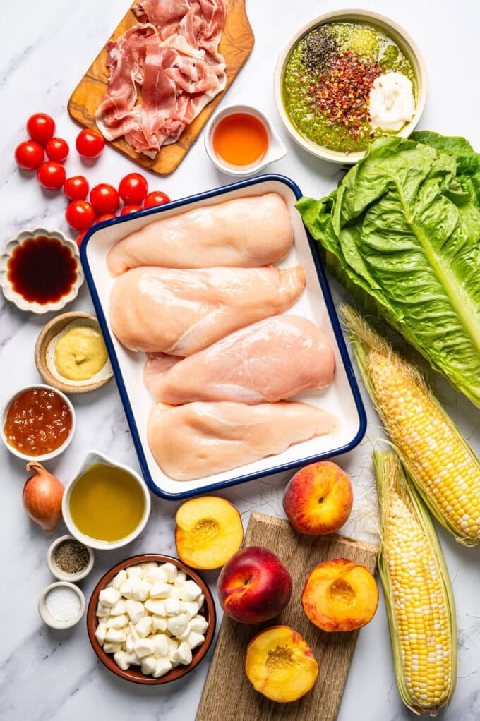 ingredients for grilled pesto summer peach salad in bowls