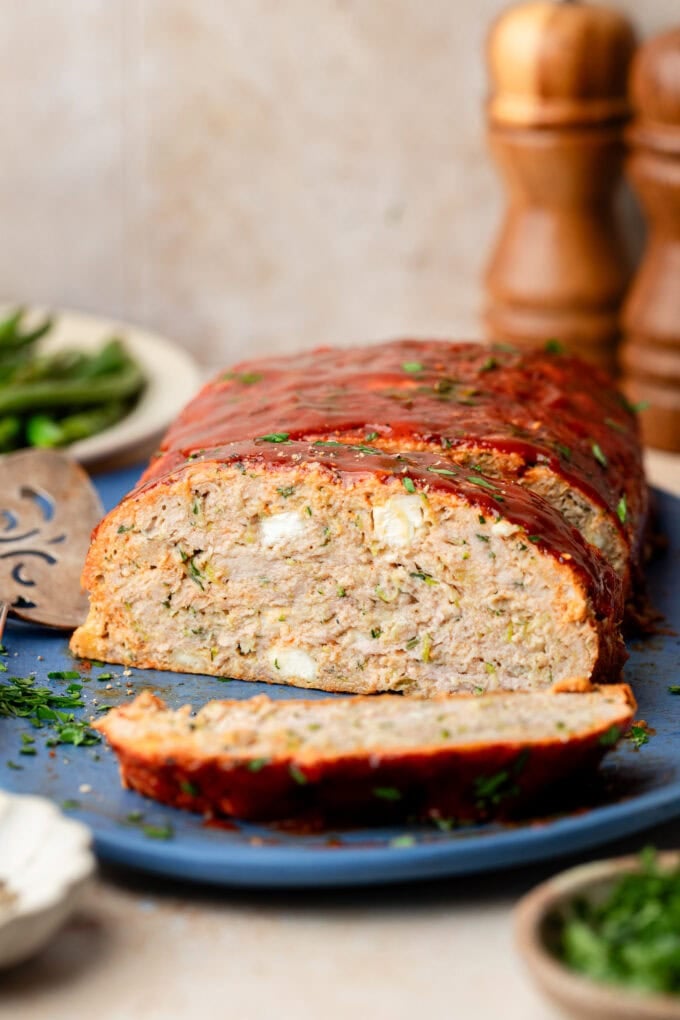 zucchini feta meatloaf sliced on platter