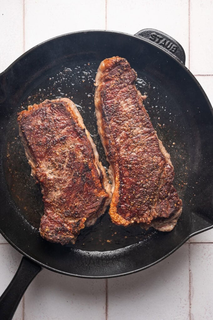 seared steak in cast iron skillet