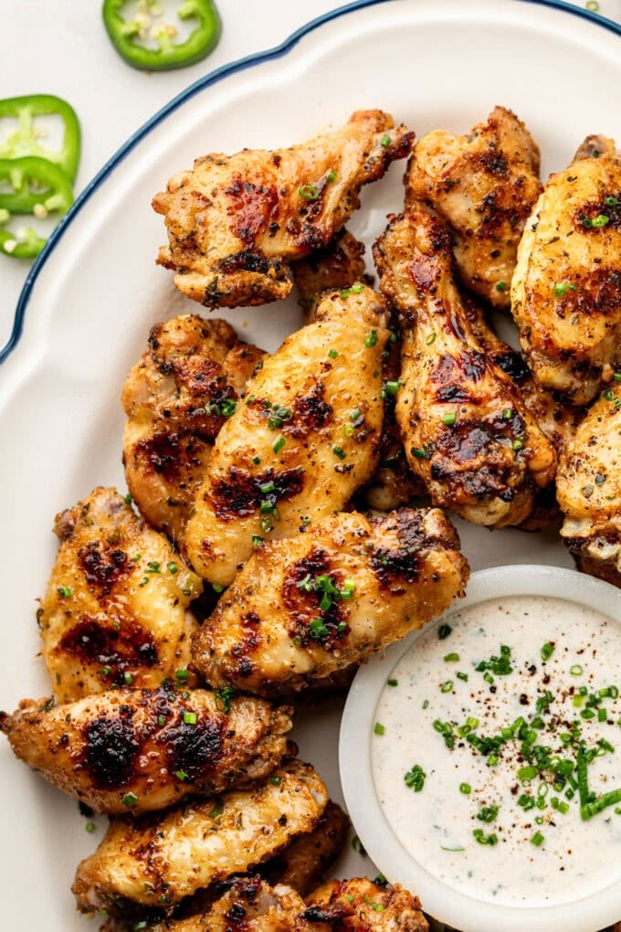 grilled chicken wings with jalapeno ranch on platter