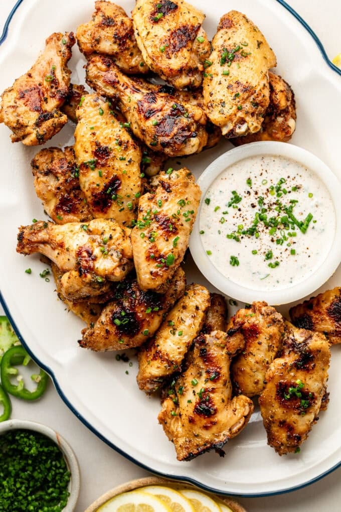 grilled chicken wings with jalapeno ranch on platter