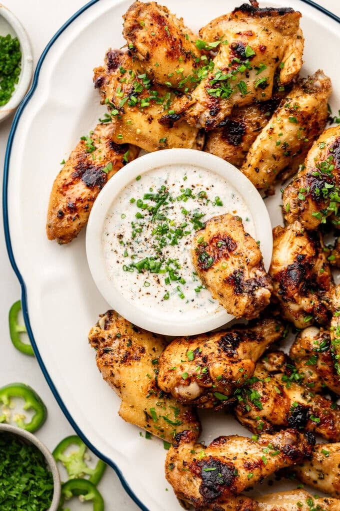 grilled chicken wings with jalapeno ranch on platter